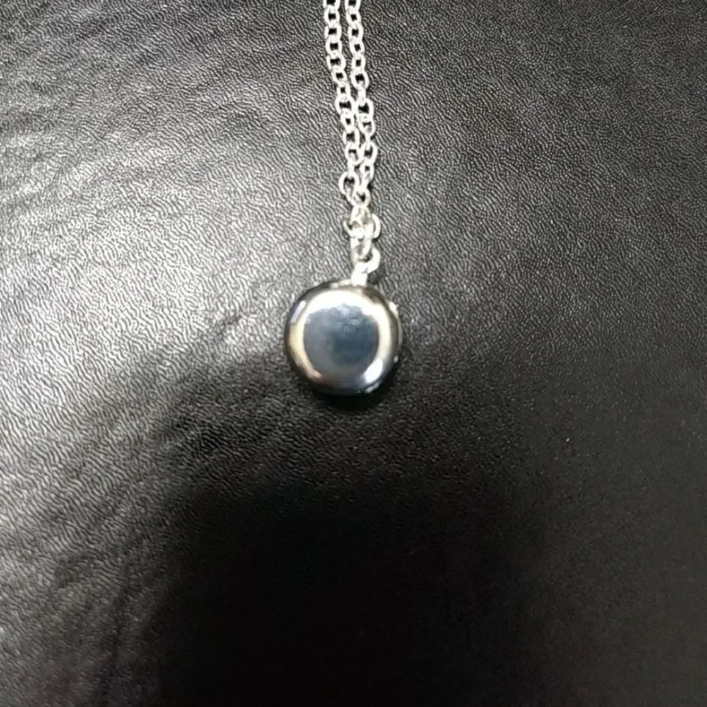 Silver tone and pink stone necklace